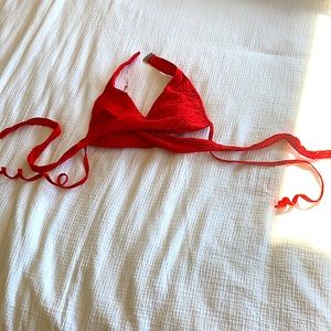 A sexy bright red bikini top perfect to spice up black bottoms